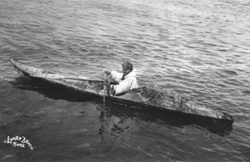 Fig. 1 Man in a King Island type kayak, wearing a rain parka, possibly of gut skin. 